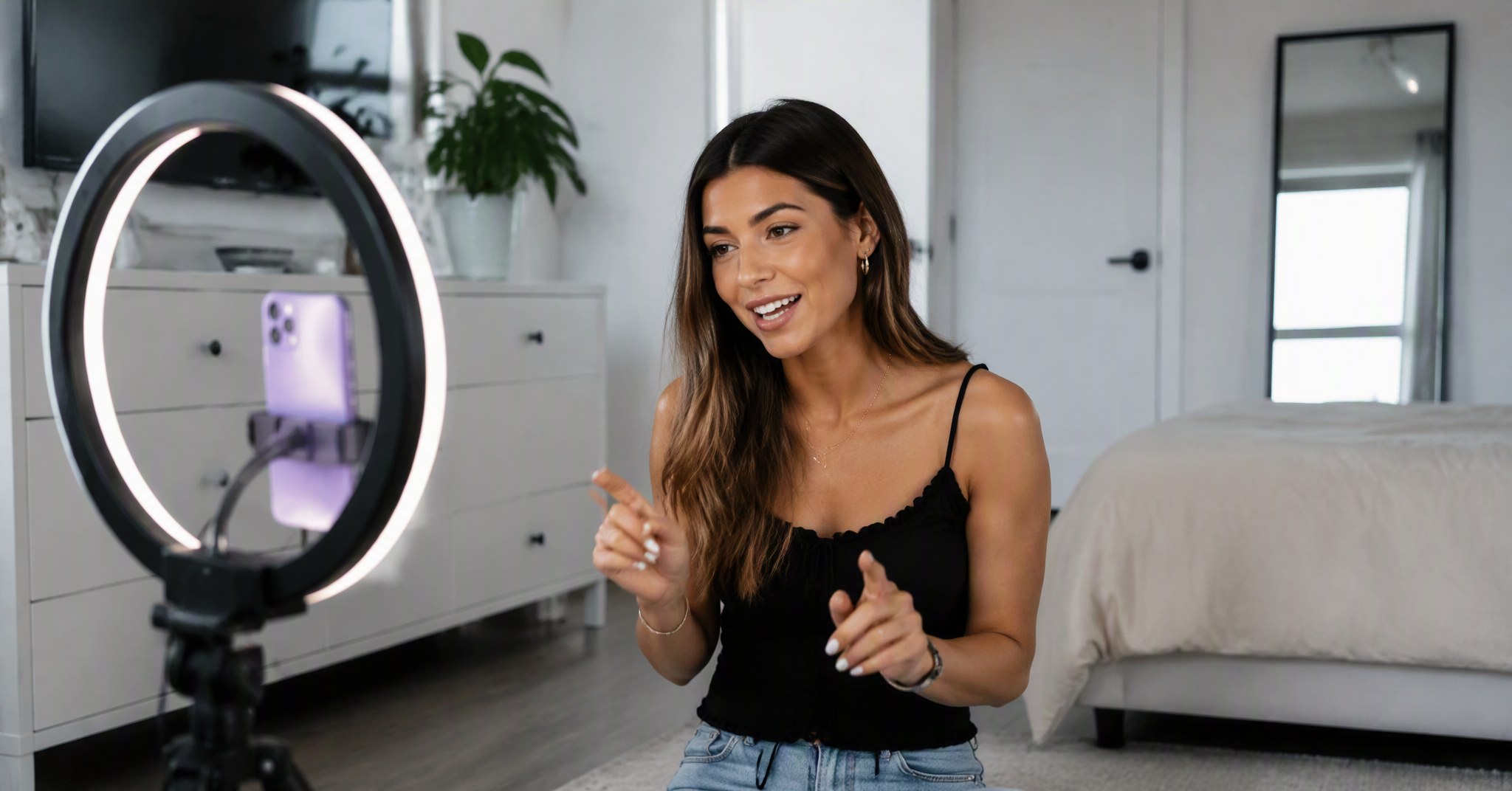 TikTok creator filming a talking head video with phone on tripod